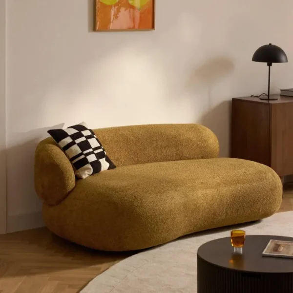 Halo-Curve-Sofa-Ochre-Details-600x600 angled view of halo curve sofa in a modern living room.
