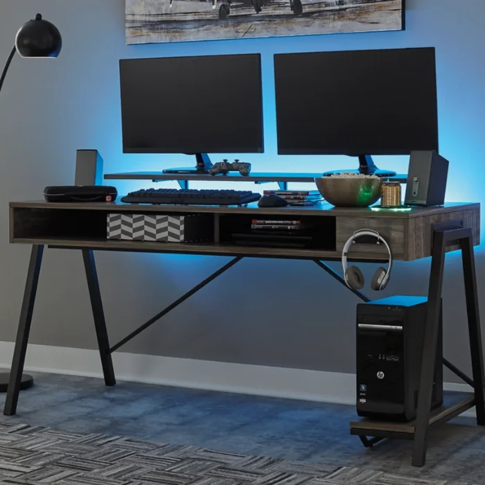 Gaming Desk 1 Roco Elite Gaming Desk featuring dual monitors, gaming accessories, and ambient lighting setup.