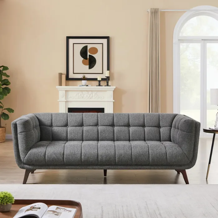 Ardrie Upholstered Sofa - Drak Grey Ardrie Upholstered Sofa in dark grey, grid-tufted 3-seater styled in a modern living room.