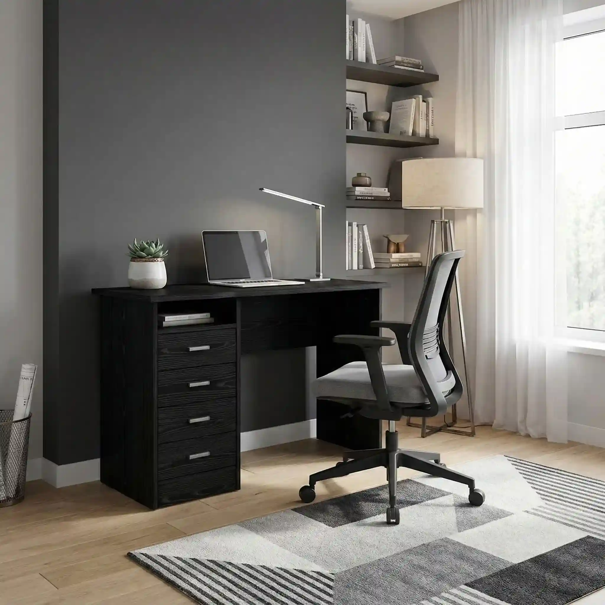 Vincent Study Table black writer desk with a grey rolling chair in a modern room