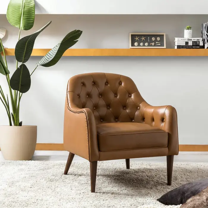 Aurum-Chair-2 Stylish brown leather armchair with tufted design, perfect for modern home decor.