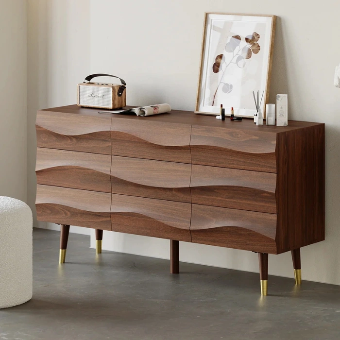 Nordic Haven Dresser Nordic Haven Dresser – angled view of wooden dresser with wave-textured drawers and brass-accented legs.